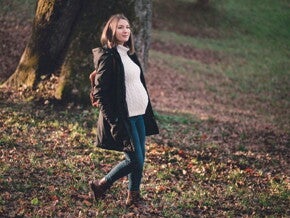 Pregnant woman on a bushwalk in a forest