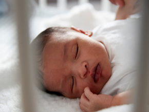 newborn baby asleep in cot newborn baby asleep in cot